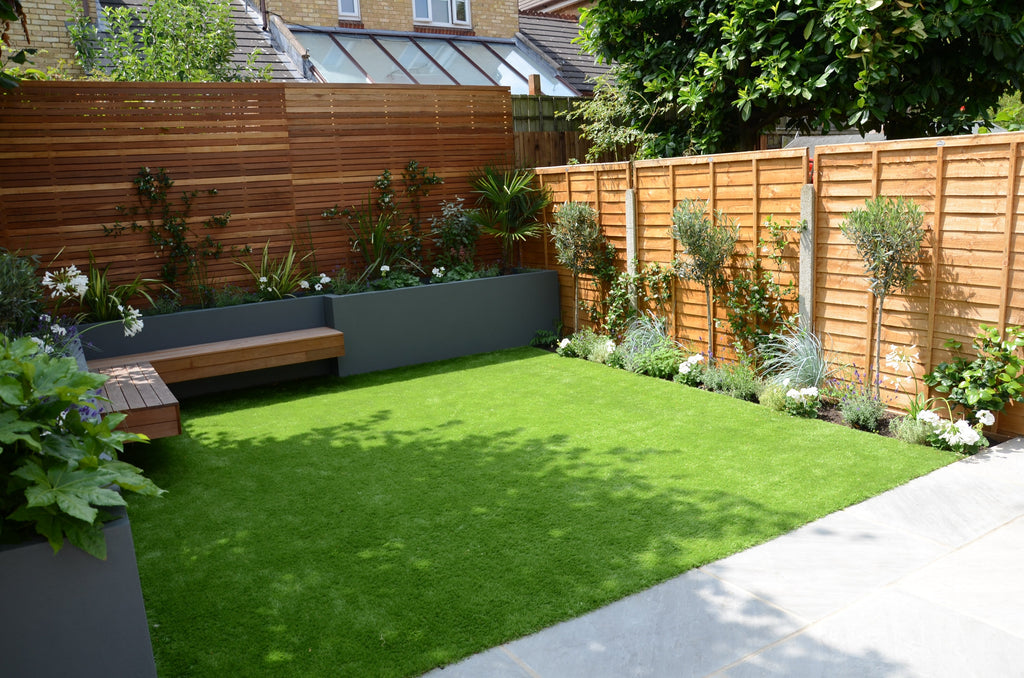 Small square artificial grass lawn with shade and sunshine.